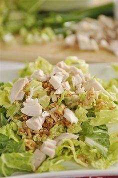 lettuce and chicken salad on a white plate