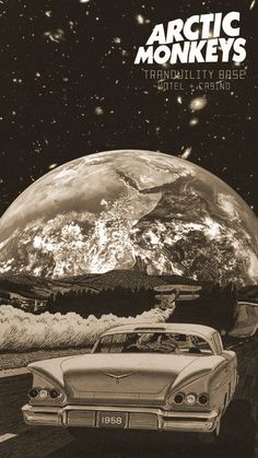 an old car is parked in front of the earth with mountains and stars above it