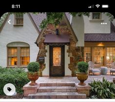 a house with stone steps leading up to the front door