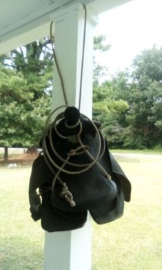 an old hat hanging from the side of a house