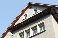 the corner of a building with two windows