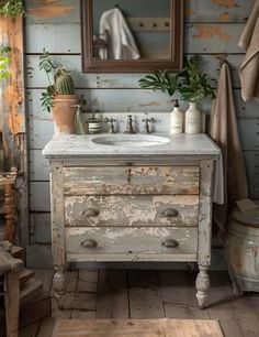 an old dresser with a sink and mirror