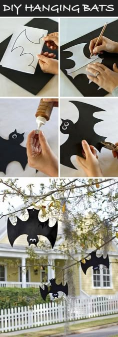 halloween decorations made out of paper bats hanging from a tree