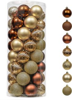 an assortment of christmas ornaments in a clear box with gold and silver baubles