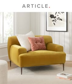 a yellow chair with some pillows on it