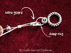 the wire is connected to two rings on top of a red carpeted area with words describing where guard and jump ring are