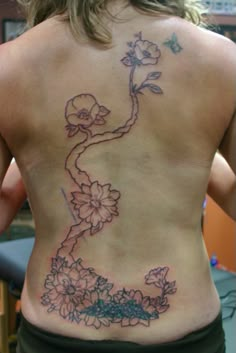 a woman with a tattoo on her back