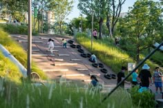 skateboarders are riding down the hill on their boards