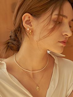 Editor's NoteThe elegant and classic jewerly from TATIANA is designed to match according to your mood- TATIANA 2019 FW collection- Brass (gold plating)- Layered necklace- Pearl necklace and Coin oval necklace in one setMeasurement (in.)one size- 14.2in. (pearl necklace)- 16.5in. (Coin oval necklace)Compostion & Care- Brass- Beware of the wearing and storage of jewelry.- The size, shape, and color of the gemstone vary from product to product, and this is not defectiveDesigner- Classic Gold Oval Pearl Necklace, Classic Oval Gold Pearl Necklace, Coin Pearl Necklace, Eagle Necklace, Necklace Gold Chain, Round Bead Necklace, Gold Coin Necklace, Necklace Layered, Pearl Necklace Set