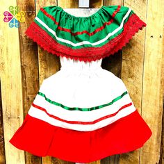 Traditional children Campesino dress, fresh and comfortable design with elastic around the waist. Made with white 'popelina' and decorated with silk and cotton lace. Perfect for 5 de Mayo or Independence day! Let your children wear their price from the Mexican culture:) Check out additional styles at GuelaguetzaDesigns.com Size Bust(around)Length 0-6Mo 60 cm/ 24 in38 cm/ 15 in 1T 70 cm/ 27 in46 cm/ 18 in 2T 80 cm/ 31 in 52 cm/ 20 in 4y 85 cm/ 33 in60 cm/ 24 in 6y 90 cm/ 35 in70 cm/ 27 in Need mo Green Ruffled Dress For Holiday, White Ribbon Dress For Dress-up, White Dress With Ribbon For Dress-up, Multicolor Cotton Holiday Dress, Multicolor Cotton Dress For Holiday, Holiday Multicolor Cotton Dress, Cute Green Dresses For Holiday, Short Sleeve Patchwork Dress For Dress-up, Green Cotton Holiday Dress