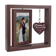 a wooden frame with a keychain attached to it that says, happy anniversary