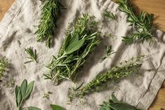 several herbs are laid out on the sand