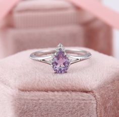 Pear Shaped Amethyst Ring, Teardrop Amethyst Ring, White Gold Purple Engagement Rings, February Birthstone Ring, Lavender Promise Ring ✧･ﾟ: *✧･ﾟ:* Welcome to Charles Davin Jewelry*:･ﾟ･ﾟ✧ Moissanite - a gemstone known to bring in luck in someone's life, the user can give off a look of elegance. You can give your special someone luck whilst showing your love to them. ✶Material: 10K/ 14K/ 18K ✶Main Stone: Natural Amethyst; 5*7mm ✶Side Stone: Moissanite; Total: 0.07ct ✶Color: D Colorless ✶Clarity: V Cheap Purple Promise Ring, Promise Rings For Her Purple, Luxury Lavender Promise Ring, Luxury Elegant Pear-shaped Amethyst Ring, Luxury Lavender Amethyst Promise Ring, Teardrop Amethyst Ring For Anniversary, Teardrop Amethyst Ring For Wedding, Teardrop Amethyst Wedding Ring, Elegant Teardrop Purple Amethyst Ring