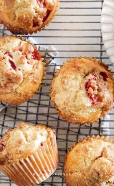 freshly baked strawberry muffins on a cooling rack