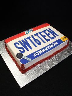 a cake that is sitting on top of a silver plate with the name switcheen written on it