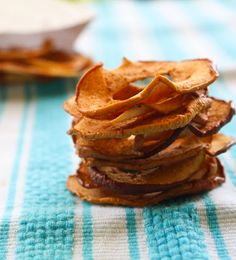 a stack of potato chips sitting on top of a blue and white table cloth