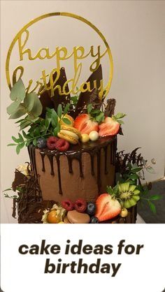 a birthday cake with chocolate icing and fruit on top