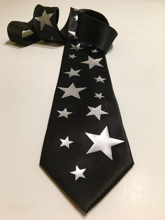 "High quality necktie. Great material. Very durable. 3.2'' at the widest point, 58\" long from tip to tip. Adult necktie. If you need something added or changed feel free to message me. Custom designs are welcome, I will do my best to make it on a tie, no set up fee for custom graphic. You pay only if you approve the final look on the tie. I try to ship the next business with USPS First Class Shipping which takes 3-5 days to arrive. If you order more then 3 ties I will ship Priority Mail 2-3 day Luxury Heart Cut Ruby Ring In Fine Jewelry Style, Suit Accessories Party, Star Gifts For Men, Star Clothes, Stars Outfit, Star Tie, Cool Clothing, Fancy Things, Star Clothing