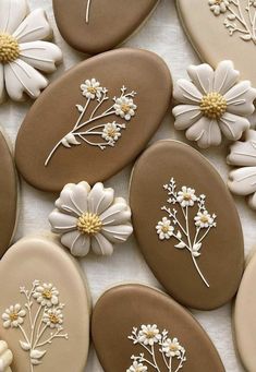 several decorated cookies with flowers on them