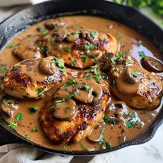 chicken with mushrooms and gravy in a skillet