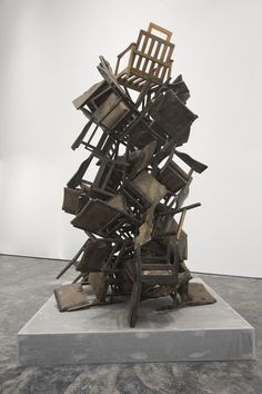 a sculpture made out of multiple pieces of wood