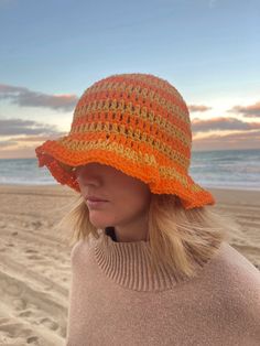 This crochet bucket hat is made by hand! The material is light and soft so perfect for a day at the beach, a fashion piece and even to keep you warm. Lightweight Crochet Hat For Warm Weather, Vacation Crochet Hat With Short Brim, Summer Crochet Cotton Hat, Wide Brim Cotton Yarn Crochet Hat For Vacation, Summer Lightweight Crochet Hat, Lightweight Summer Crochet Hat, Adjustable Cotton Yarn Crochet Hat For Beach, Lightweight Summer Crochet Hat For Warm Weather, Adjustable Cotton Crochet Hat For Beach