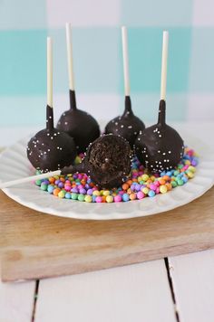 chocolate cake pops with sprinkles on a plate