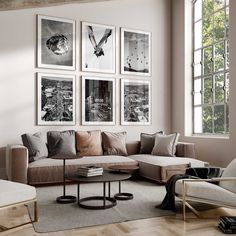 a living room filled with furniture and pictures on the wall