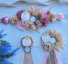 three ribbons with flowers and pumpkins on them