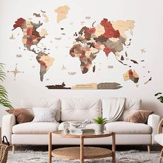 a living room filled with furniture and a large wall map on the wall above it