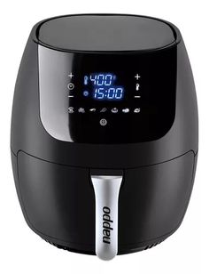 the digital clock is on top of an air fryer