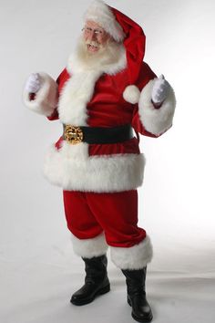 a man dressed as santa claus is posing for the camera