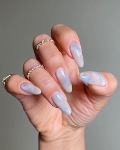 This design features a soft, almost translucent white marble pattern on almond-shaped nails. The delicate swirls of white create an ethereal effect, giving the nails a light and airy appearance. The glossy finish adds a subtle sheen that enhances the overall elegance of the design. This look is perfect for those who prefer a minimalist yet sophisticated manicure, suitable for any occasion.  Photo credit by: @dvok_us Milky Nails, September Nails, Nude Nail Designs, Subtle Nails, Almond Nails Designs, Pastel Nails, Minimalist Nails, Manicure Y Pedicure