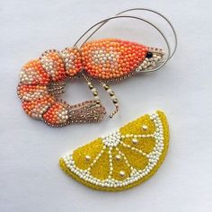 two pieces of beaded jewelry are laying next to each other