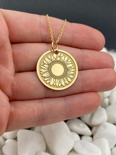 14k Solid Gold Sunflower Necklace, Personalized Sunflower Pendant, Gold Sunflower Coin 14k Solid Gold Choose What Size You Want the Pendant Using The First Option Box Choose Chain Length Or Without Chain Using The Second Option Box Photos Are For The 25.4 mm / 1 Inch Diameter Pendant Pendant thickness : 0.7mm  Contact us if you want it thicker Inner diameter of jump ring : 5mm Contact us if you need it bigger  Chain width : 1.30mm     ♥ Material of pendant and chain: Solid Gold k14 ♥ Packaging: Anniversary Gold Jewelry With Sunflower Design, Gold Engraved Flower-shaped Necklace, Gold Engraved Flower Shaped Necklace, Yellow Gold Jewelry With Sunflower Design As Gift, 14k Gold Round Birth Flower Jewelry, Sunflower Design Jewelry For Anniversary, Sunflower Design Flower Jewelry For Anniversary, Yellow Tarnish-resistant Jewelry, 14k Yellow Gold Necklace With Birth Flower Detail