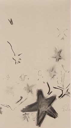 a black and white drawing of a bird flying in the air with seeds coming out of it