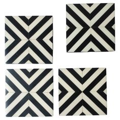 four black and white tiles with diagonal stripes