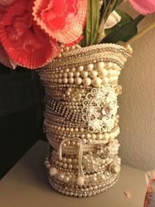 a vase filled with lots of beads and flowers