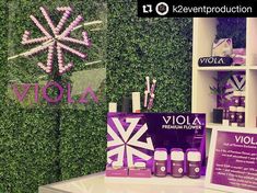 an assortment of products displayed in front of a green wall with snowflakes on it