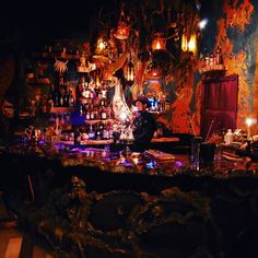 a bar with many bottles and candles on it