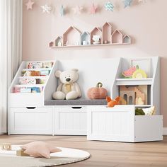 a child's room with pink walls and white furniture