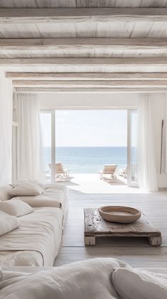 Minimalist coastal villa in Formentera, Spain, featuring Mediterranean design, soft natural light, and serene beach views. Minimalist Villa, Mediterranean Beauty, Luxury Coastal, Coastal Holiday, Places To Rent, Luxury Rentals, Global Travel, Luxury Villas, Ocean Breeze