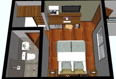 an overhead view of a small bedroom and living room in a tiny apartment with wood flooring