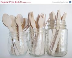 mason jars filled with wooden spoons and utensils