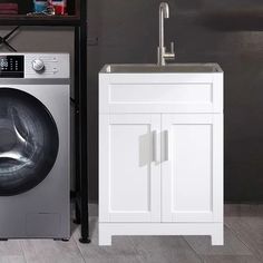 a washer sitting next to a dryer in a room