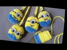 four yellow and blue balls of yarn with eyes