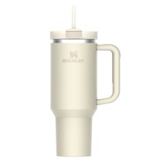 the stanley travel mug is shown in white and has a handle that holds a straw