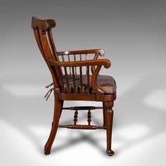 an old fashioned wooden chair on a white background