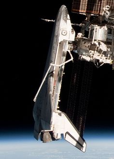 the space shuttle is docked to the international space station in this photo taken by nasa astronauts