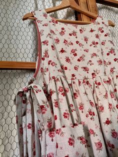 a dress hanging on a rack in a room